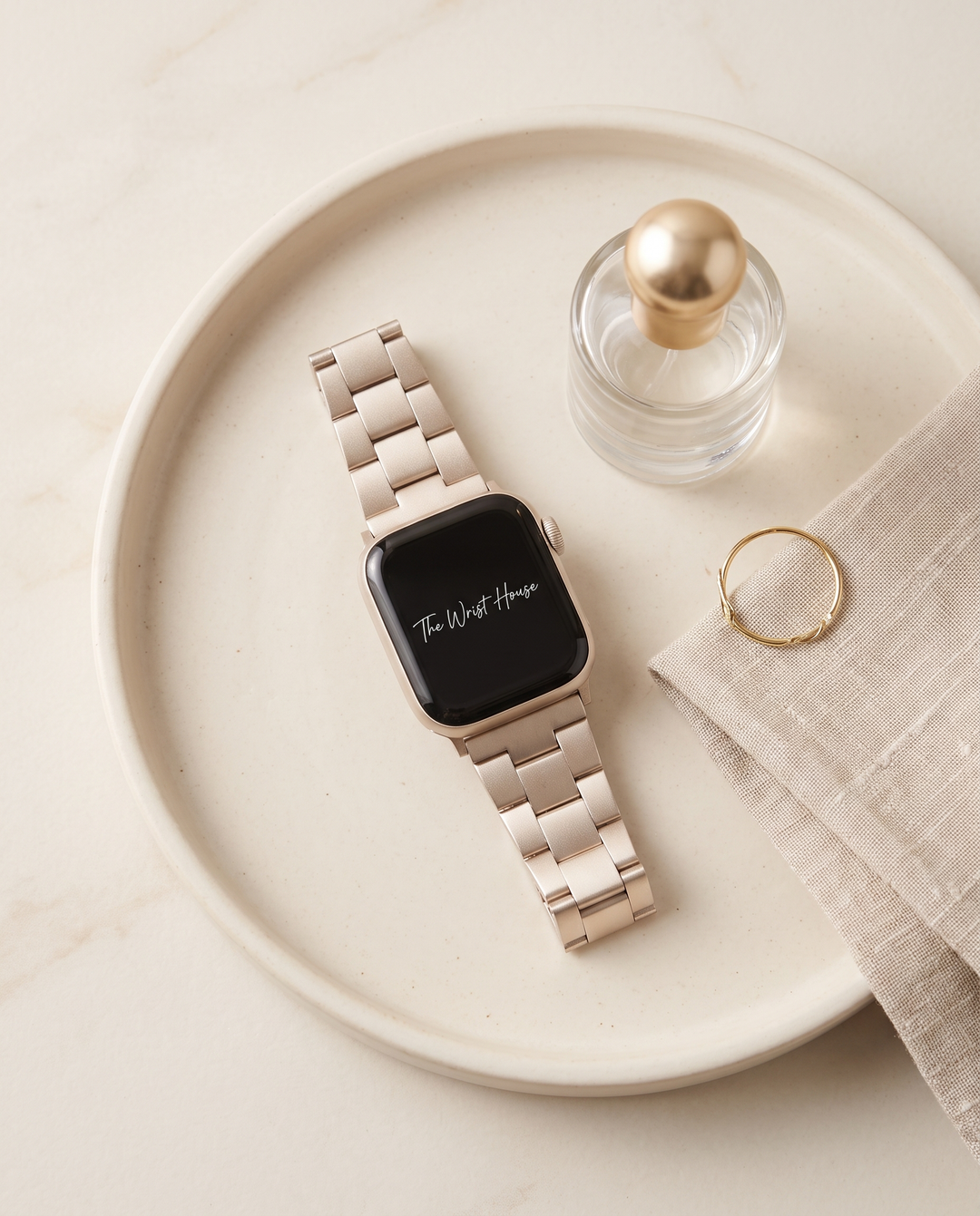 Classic link band for Apple Watch on a ceramic tray