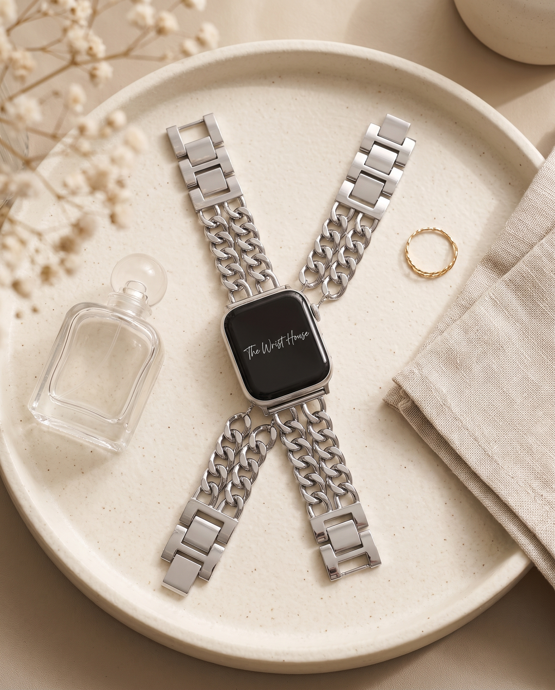 Double chain band for Apple Watch on a ceramic tray